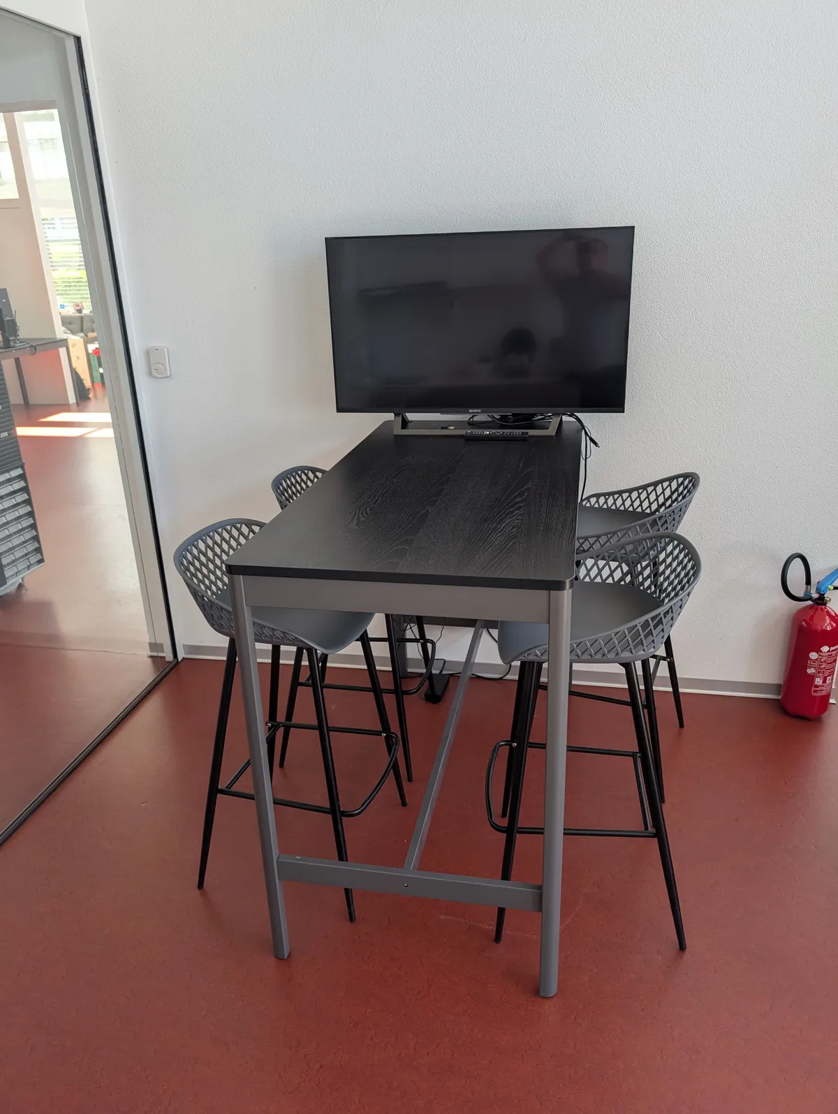 Informal meeting room with multimedia setup.